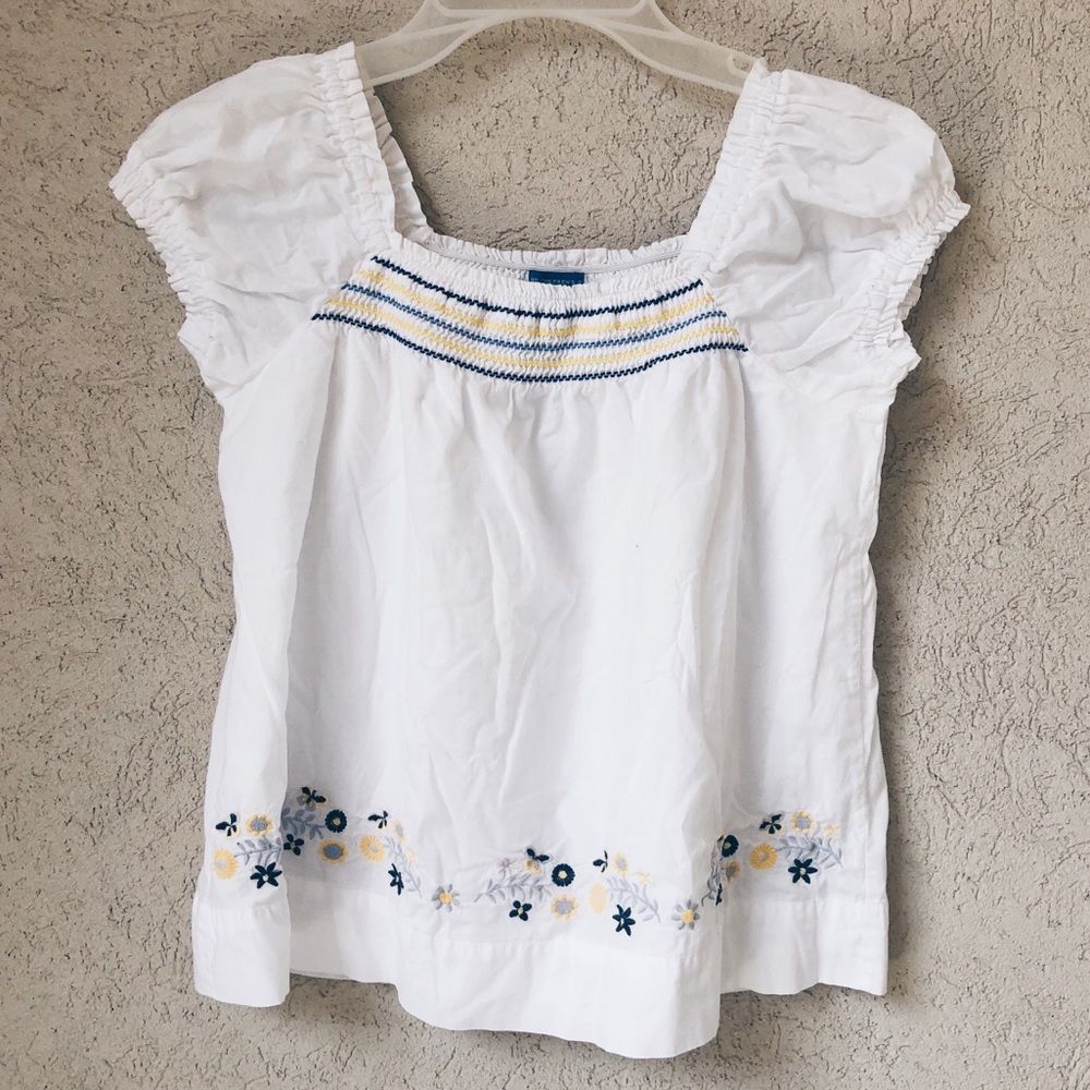 White ruffled blouse